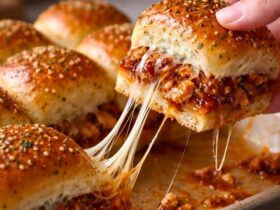 Use a rotisserie chicken from the store to make this a very fast 15-minute prep meal. Add cooked bacon bits inside the sliders for a smoky and salty flavor boost everyone loves. Swap the red onion for pickled jalapeños if you want a spicy kick in every bite. Use pepper jack cheese instead of mozzarella to add a little bit of heat to the sliders. Ensure the butter is slightly cooled before brushing so it does not soak into the bread too fast. Make these ahead of time and keep them in the fridge until you are ready to bake.